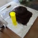 Find a cup that will fit in the cake for the lava.
