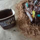 Cover the aluminum with cocoa powder or crumbled cookies to look like dirt.