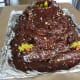 Roll up the aluminum foil to form a moat and add decorations.