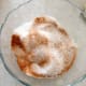 Mix up a teaspoon of cinnamon with 2 tablespoons of sugar.