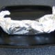 Foil containing Arbroath smokie is wrapped in to sealed but loose parcel