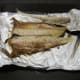 The bone lifts easily away from the grilled Arbroath smokie