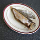Skin peels easily off hot Arbroath smokie