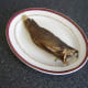 Reheated Arbroath smokie is plated
