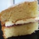Sandwich the two layers together. . Dust the top with icing (confectioner's) sugar. Slice and serve.