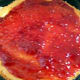 Cover one layer of the cake with raspberry jam.
