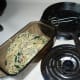 Pour pasta dish into a serving dish that you can refrigerate after.