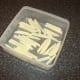 Uncooked fries are dried off in fridge