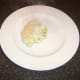 Portion of ling fish pie is plated