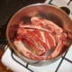 Beef and bones are added first to stock pot