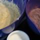Add the flour/cocoa mixture and sour cream to the creamed butter/sugar/eggs, in three alternating lots.