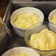 Add boiling water to 1/3 way up dishes. Bake.