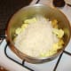 Washed rice is added to the biryani spice mix