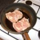 Browning and sealing the boned chicken thighs