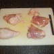 Skin is peeled from chicken thighs