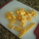 Slice American cheese into pieces, add to zippered bag.