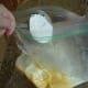 Add powdered sugar to butter and cheese mixture.