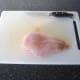 Gently press the two chicken breast fillets together around the spicy pork stuffing