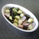 Season vegetables and stir in olive oil before roasting