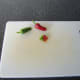 Cut off the tips of each chili pepper and finely dice