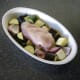 Lay stuffed chicken breast on bed of vegetables