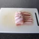 Roll stuffed chicken breast in pancetta
