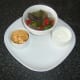Plate spicy vegetables, Mexicana cheese, and sour cream