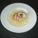 Lay stuffed chicken breast on linguine