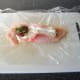 Add sun-dried tomatoes and basil to chicken breast and fold over sides