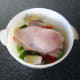 Lay stuffed chicken on bed of vegetables