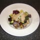 Serve stuffed chicken breast on a bed of roasted Mediterranean vegetables