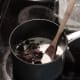 Add chocolate to melted butter in saucepan.