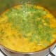 Coriander is added to curried fish soup