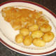 Plated breaded pollack and roast potatoes