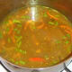 Fish stock is added to sauteed vegetables and spices