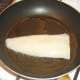 Pollack fillet is fried initially on its skin side