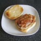 Bacon slices are laid on top of pork steak