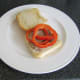 Bell pepper slices are laid on steak