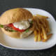 Burger style steak, salad and garlic mayo sandwich with fries