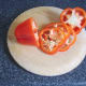 Slices are cut from a red bell pepper