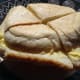 Slice the buttered crusts into four quarters