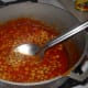 Add the pigeon beans. Let the mixture boil a little.