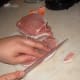 Trimming the pork chops.