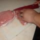 Preparing the pork chops.