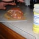 Seasoning the meat.