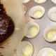 Mix batter according to directions on box (using egg substitute and applesauce for lower calorie, no fat version). Fill about 30 mini muffin tins with about 1 TB batter each.