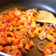 Cook onions and sweet potato until soft.