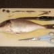 Preparing a whole sea bream for the oven