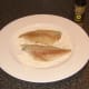 Bream fillets are patted in seasoned flour