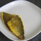 Curried sea bream fillets are plated